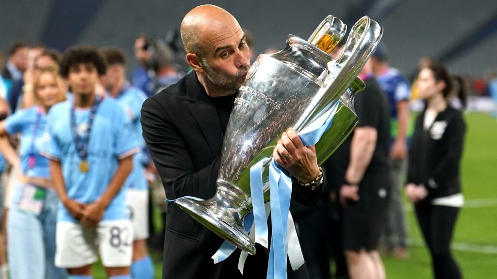 Pep Guardiola celebrates after winning the Champions League